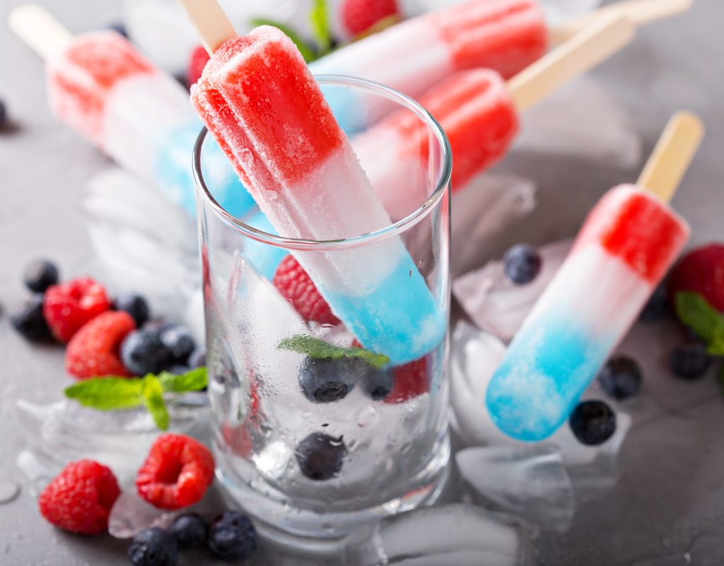 Patriotic popsicle drink and a glass