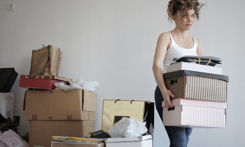 A woman organizing and moving boxes