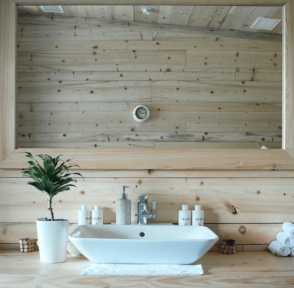 Lookat at the sink of the bathroom and the beautiful and simple accessories.
