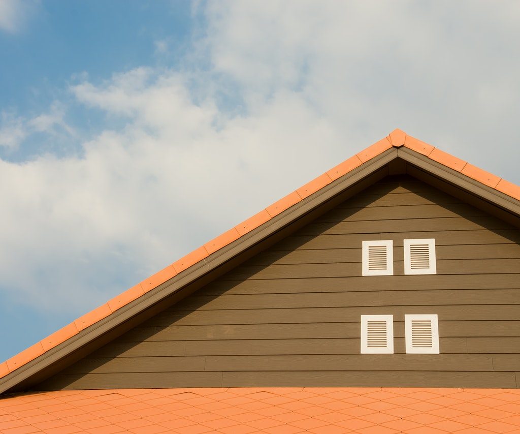 orange and brown house with pointed roof