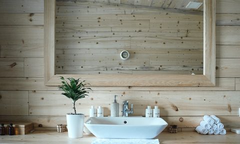 small bathroom with wood walls