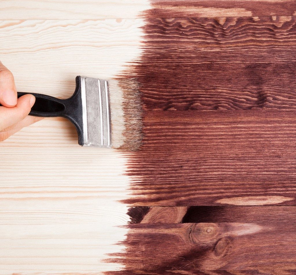 stain being painted on a table