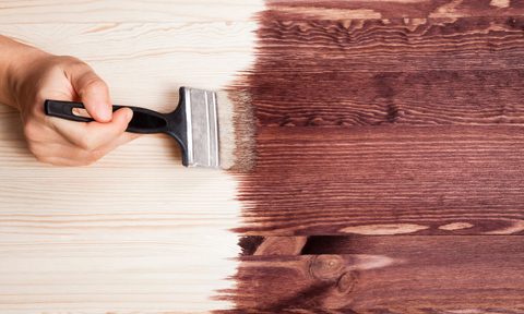stain being painted on a table