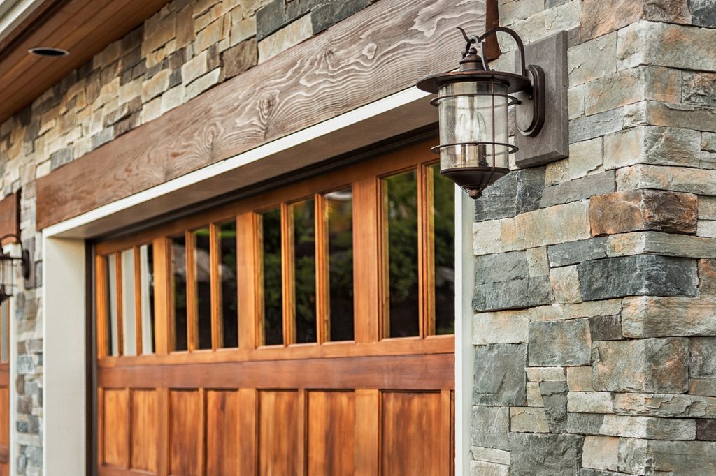 Wood garage door on brick building