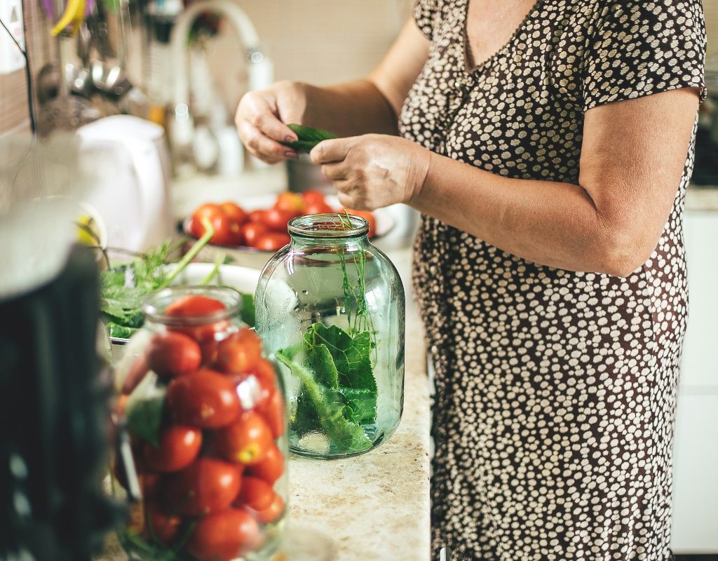 woman in kitchen pickling vegetables