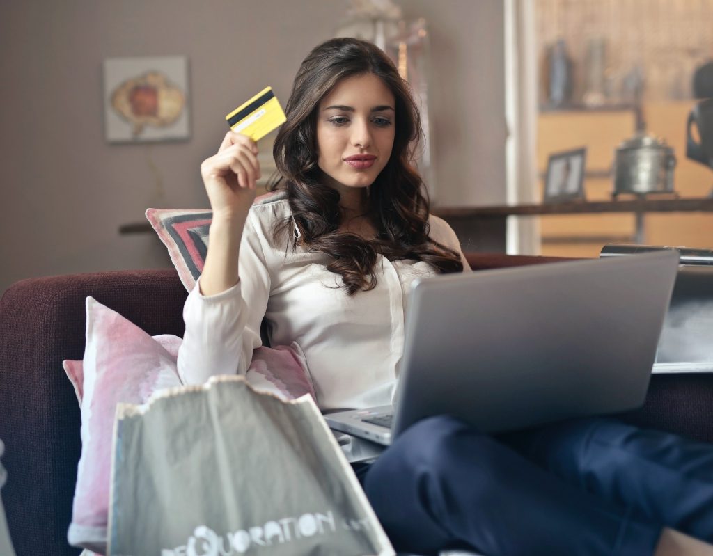 woman with credit card checking credit report