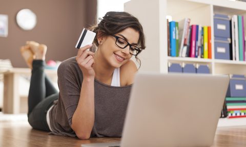 Woman doing online shopping at home