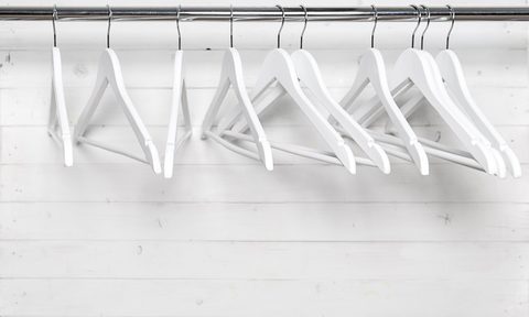 wooden hangers in a closet