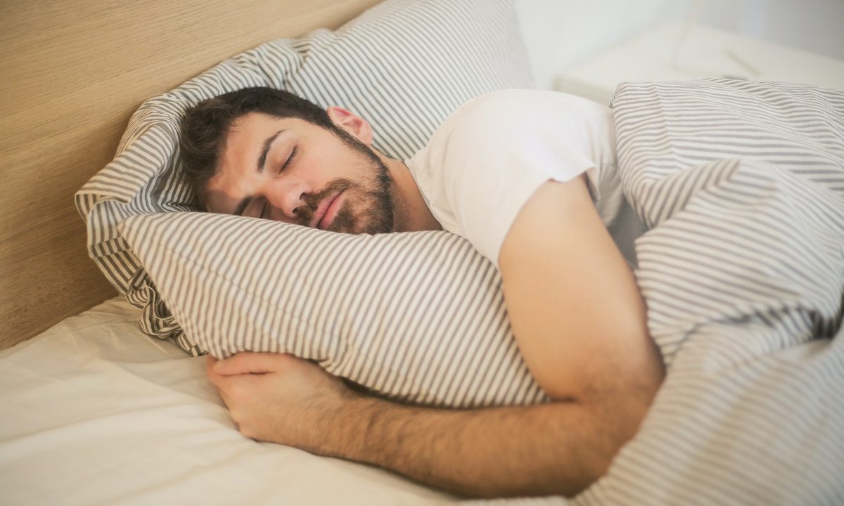 how often to replace pillows man asleep in bed