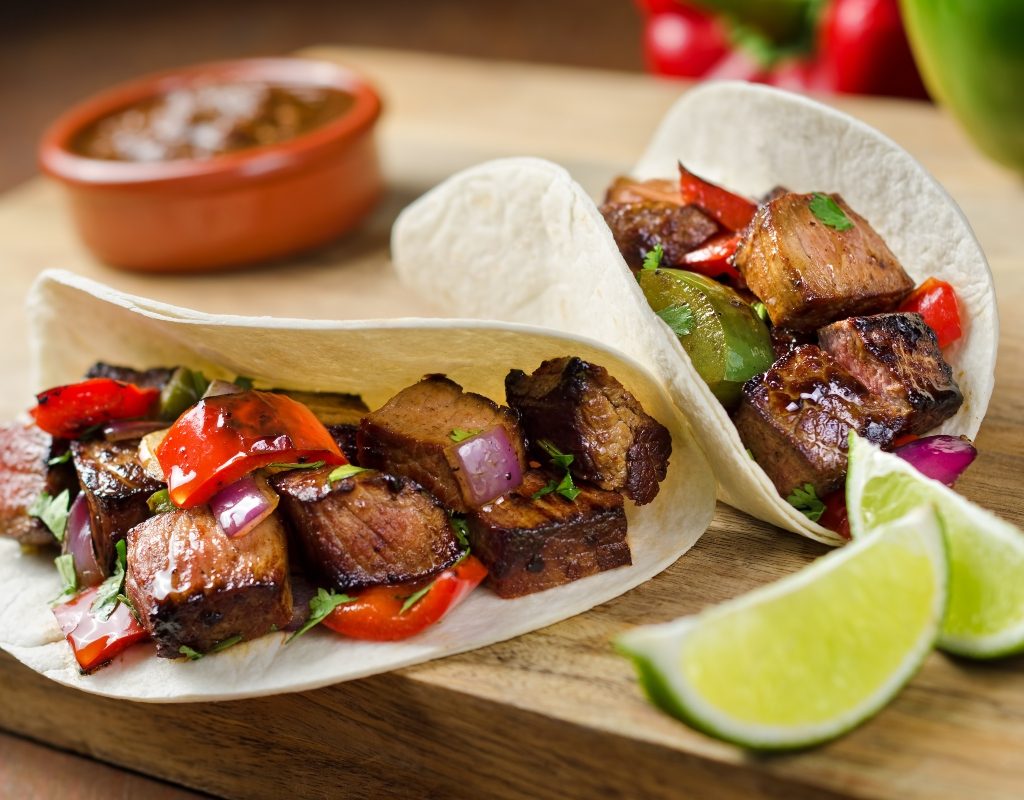 beef steak fajitas and tortillas on counter
