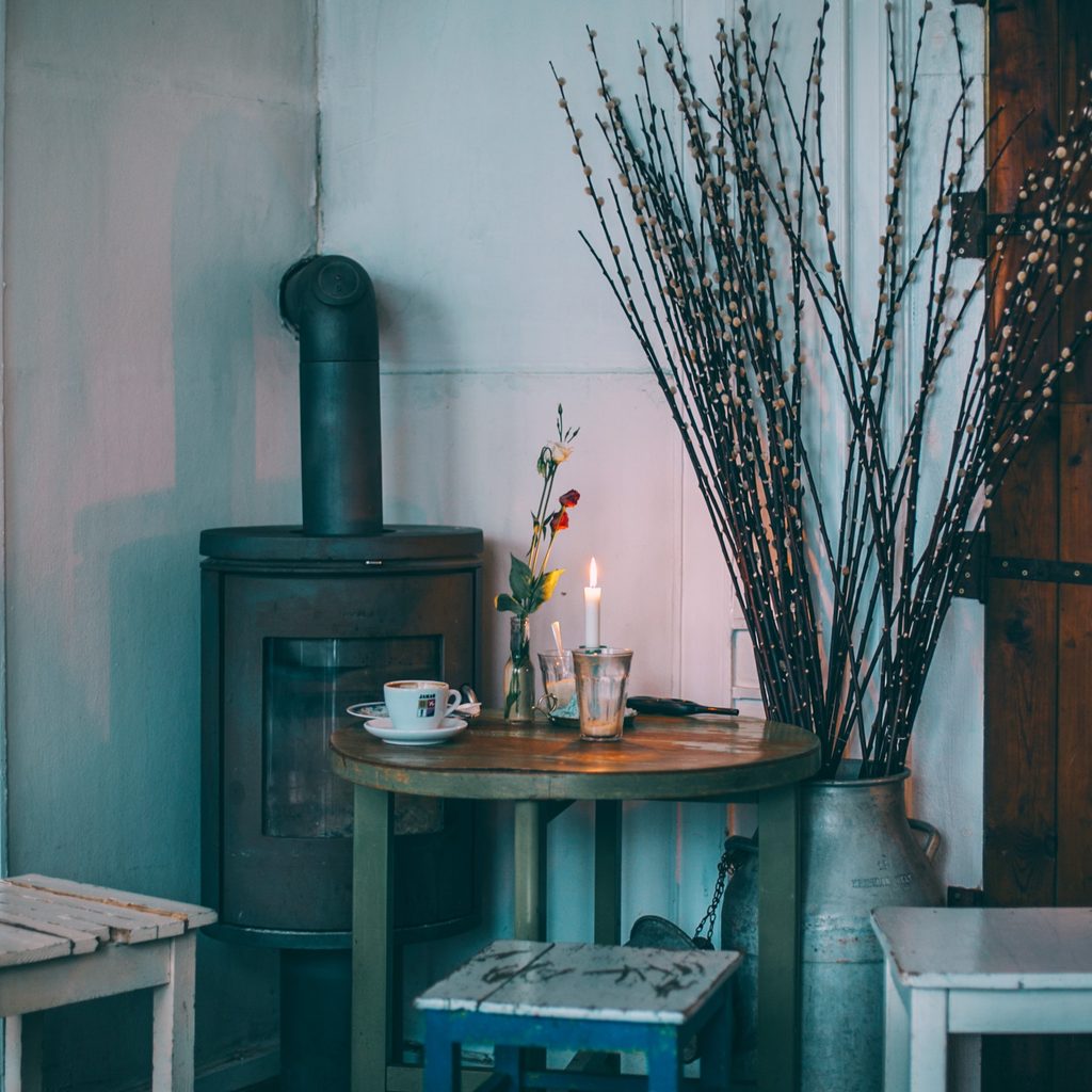 Old wooden furniture next to wood burning stove
