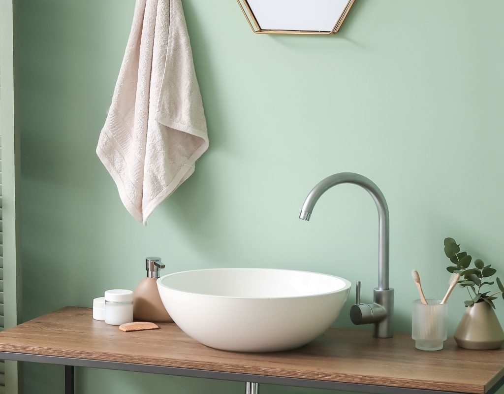 bright modern bathroom with a blue wall