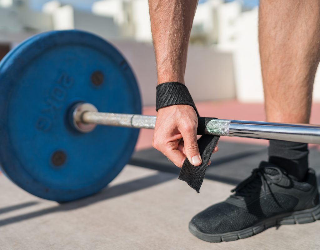 Close-up of hand on a weightlifting bar