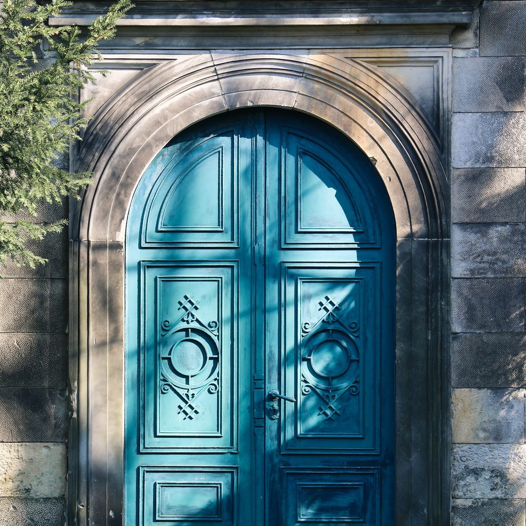 Light blue door in stone building