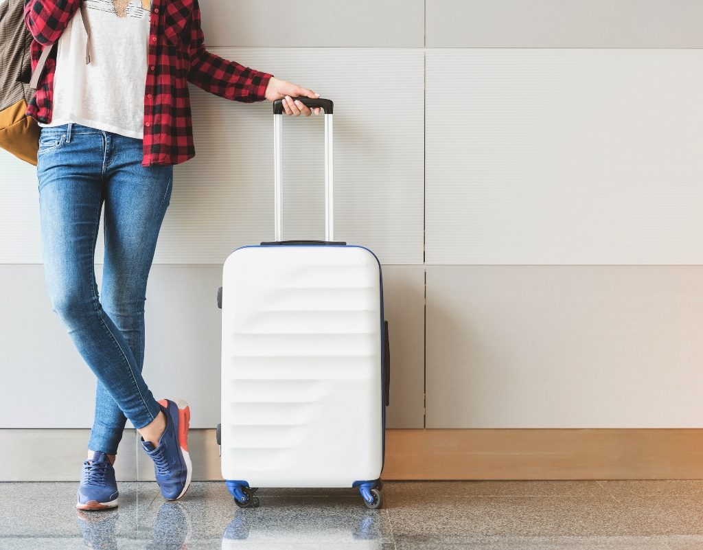 Person with luggage at the airport