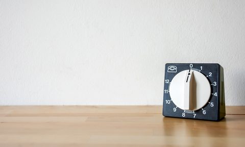 black and white kitchen timer on wood surface