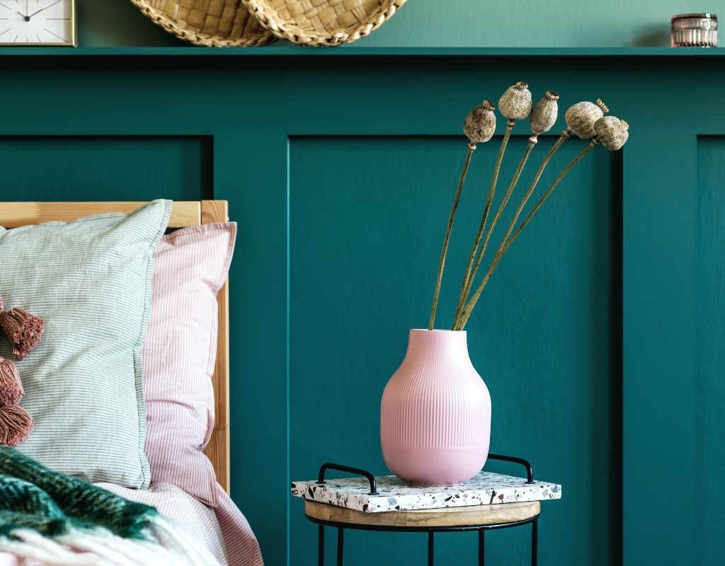 dark green wall paneling in bedroom