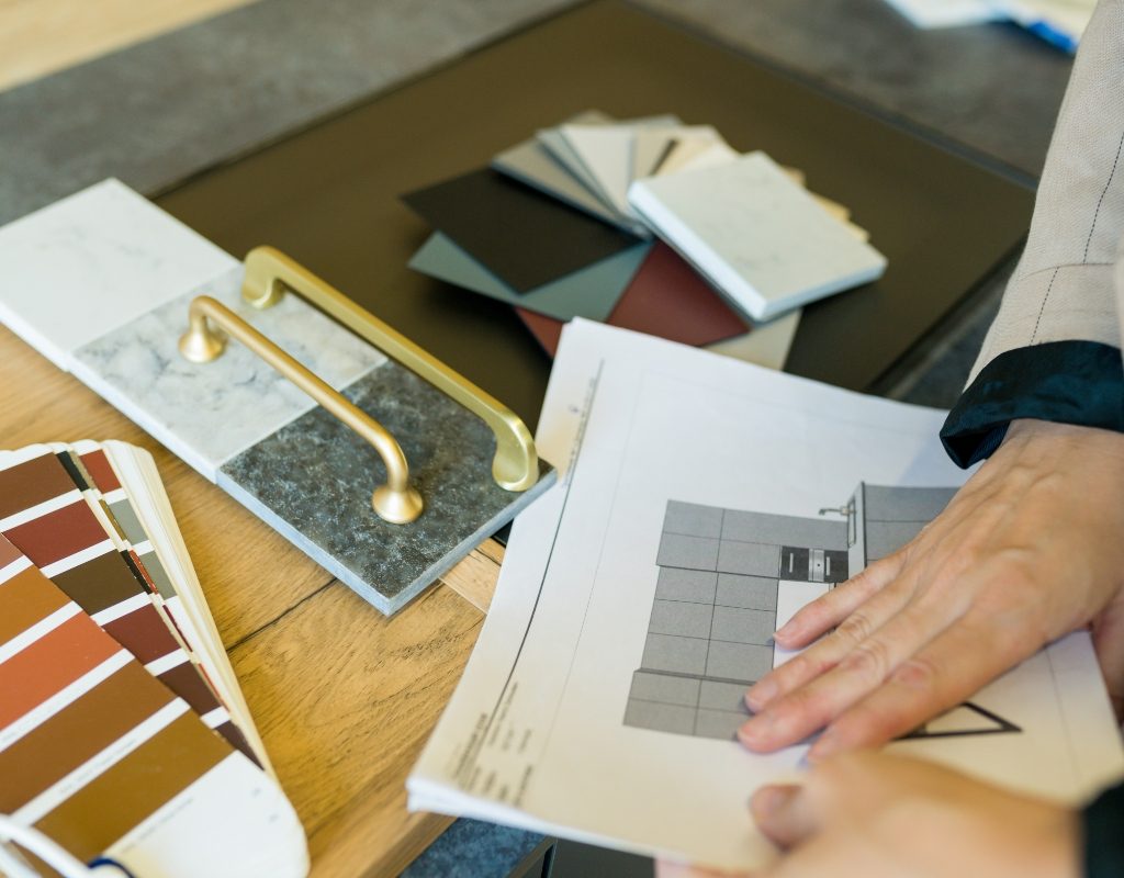 person choosing kitchen fixtures and colors for remodel