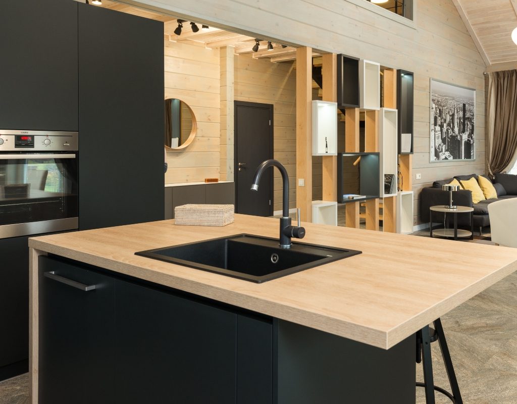 Kitchen with dark cabinets and wooden countertop
