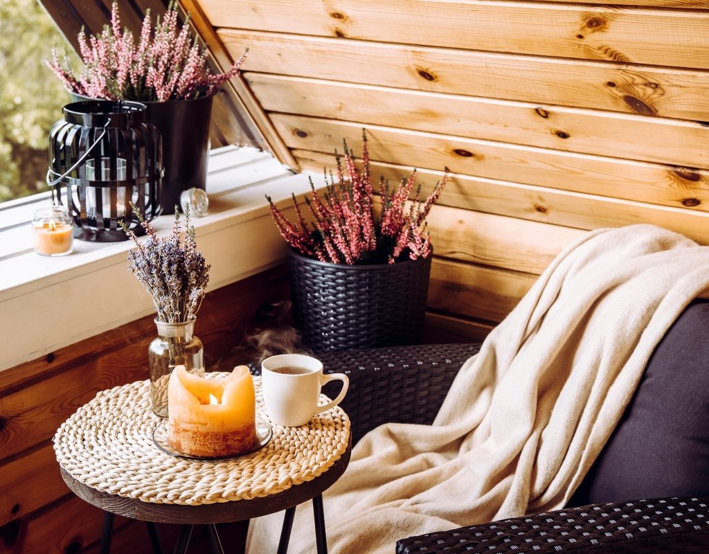 Fall home decor nook with blanket and candle