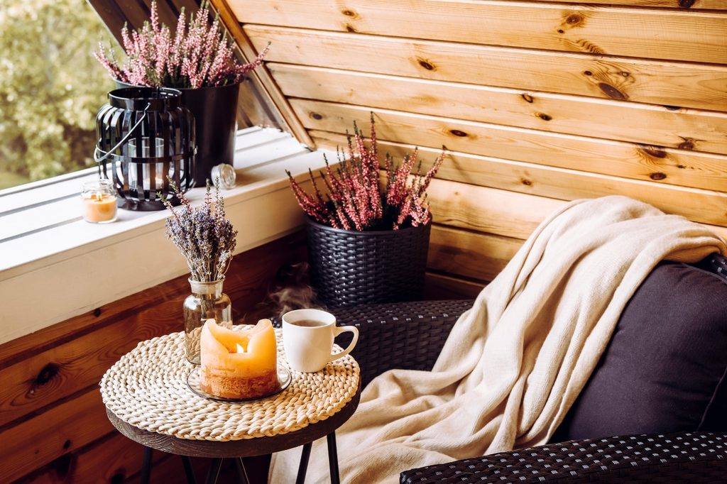 Fall home decor nook with blanket and candle