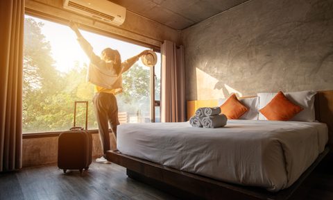 Woman stretching in front of window