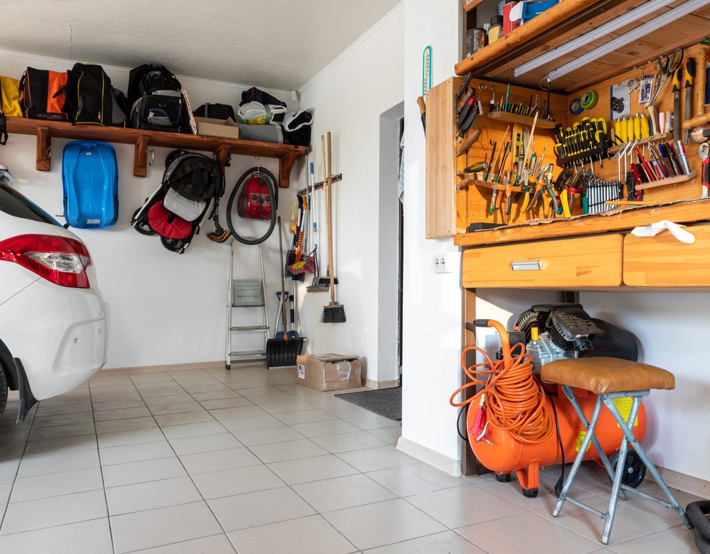 Garage interior with car and tool bench