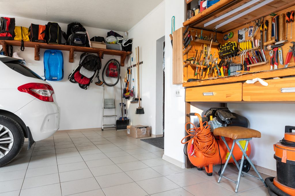 Garage interior with car and tool bench
