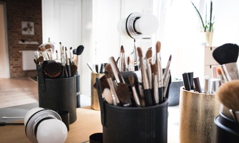 makeup brushes in cup organizers