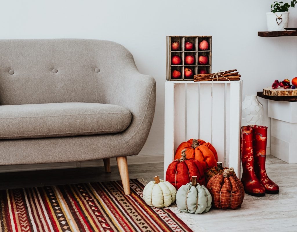 Gray modern sofa with fall decorations