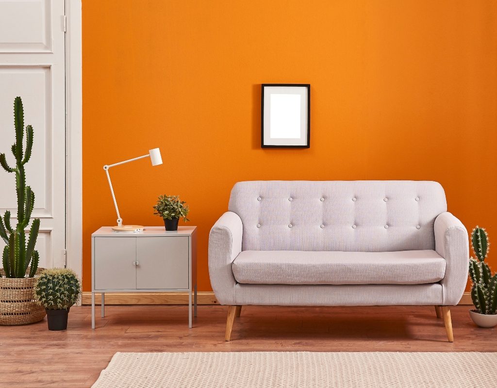 orange feature wall in living room