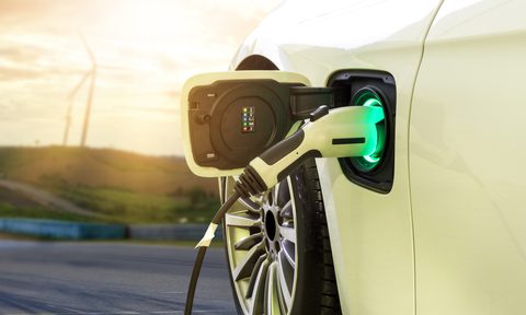 White electric vehicle charging port with charger connected