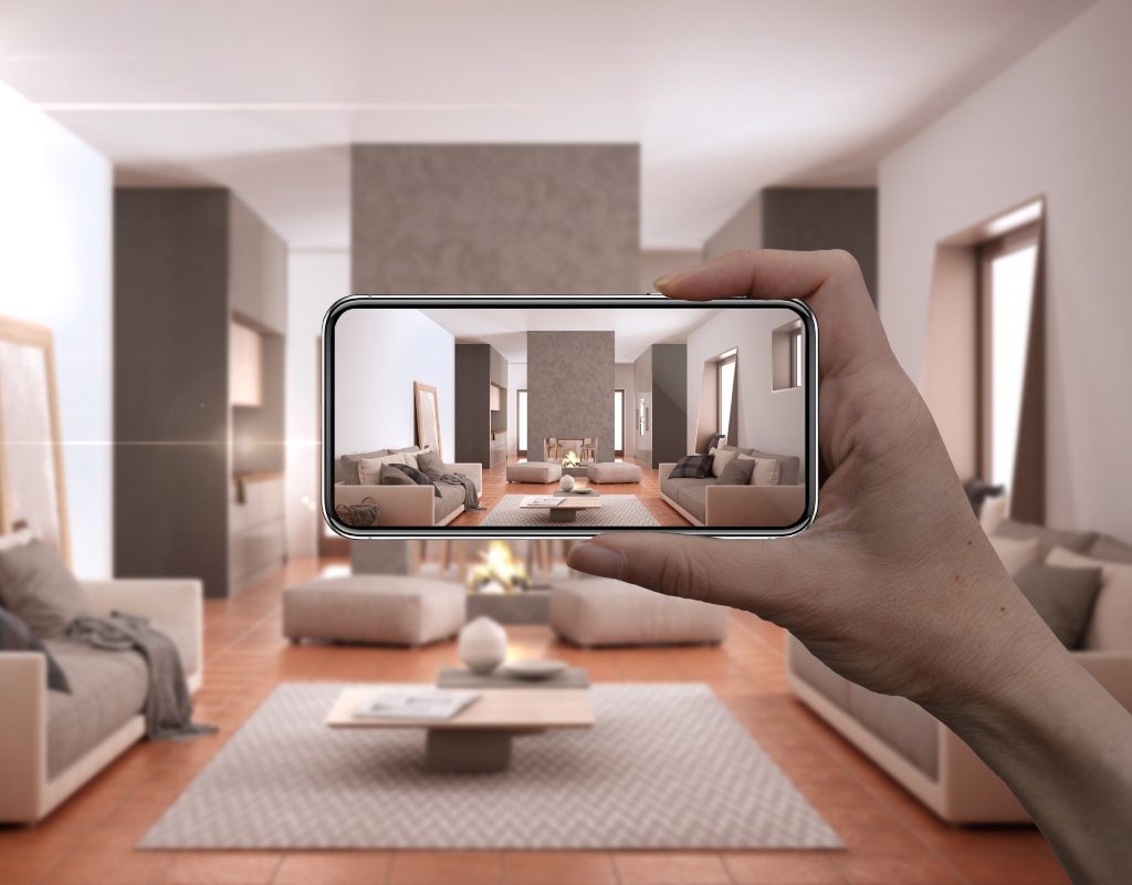 Person holding a smartphone for AR home decor