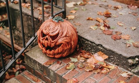 Scary Halloween pumpkin decoration on steps