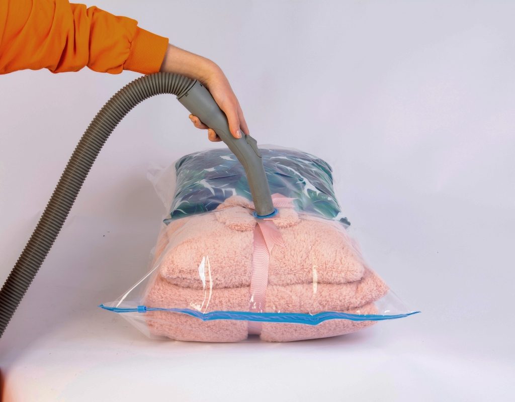 Person vacuum sealing clothing