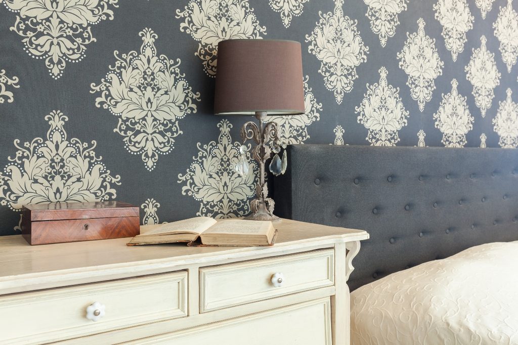 Blue and white vintage wallpaper in bedroom
