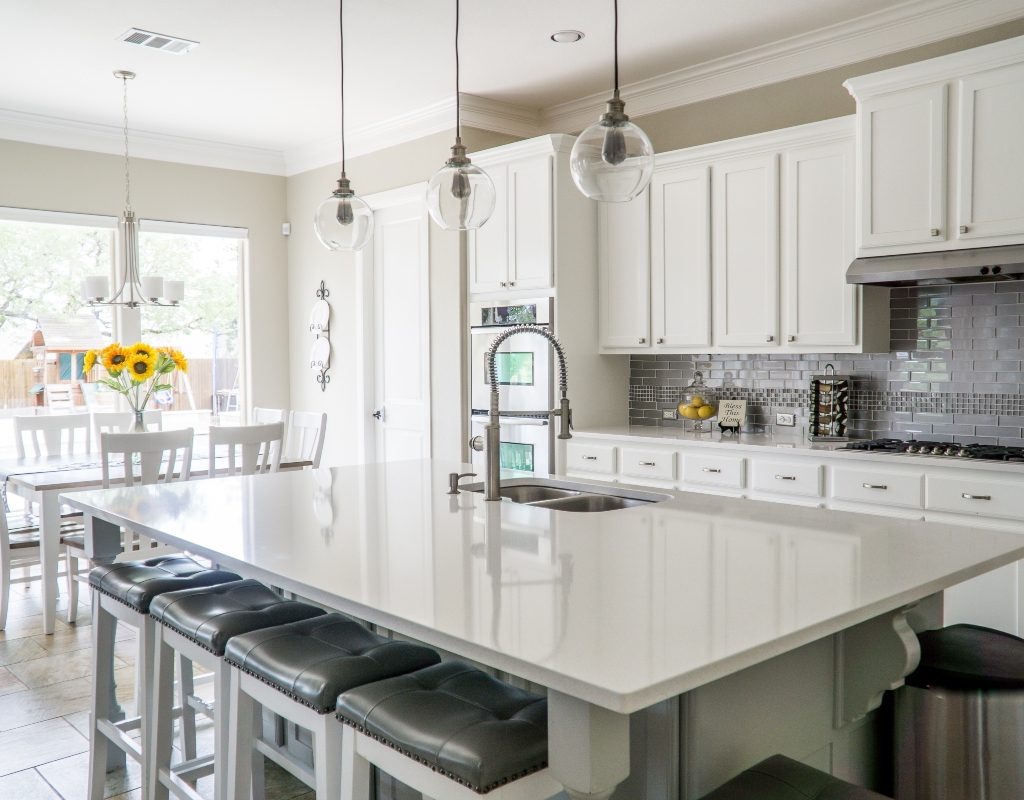 white and grey kitchen with white countertops