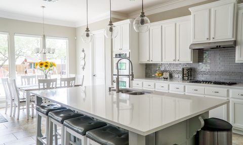 white and grey kitchen with white countertops