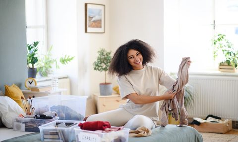 Woman organizing her summer clothing