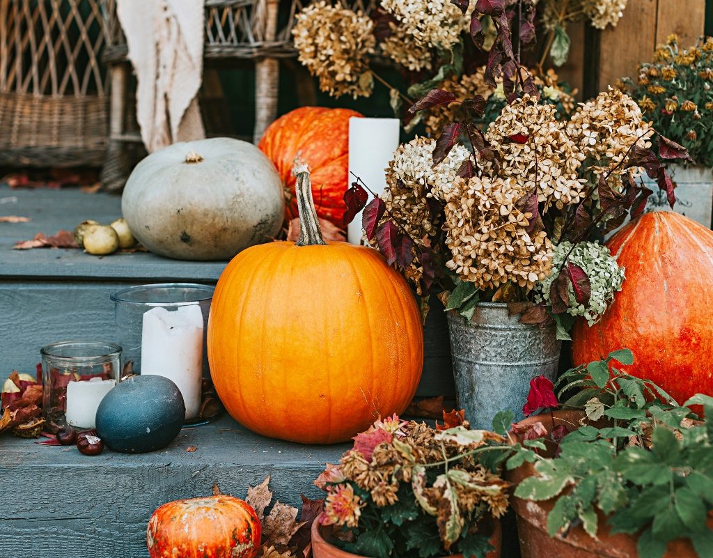 Fall pumpkin decor and flowers on stairs