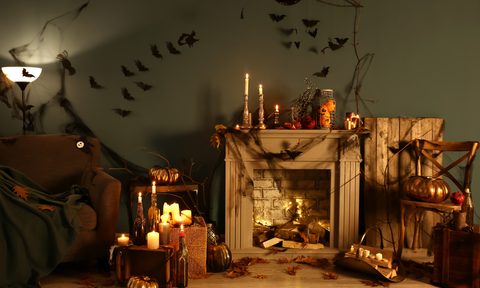halloween decorations in room with fireplace