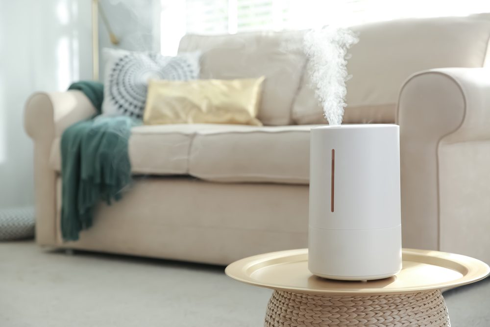 humidifier on accent table in bright living room