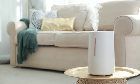 humidifier on accent table in bright living room
