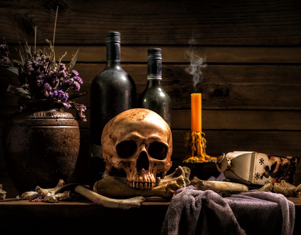 skull and candles halloween decor on table