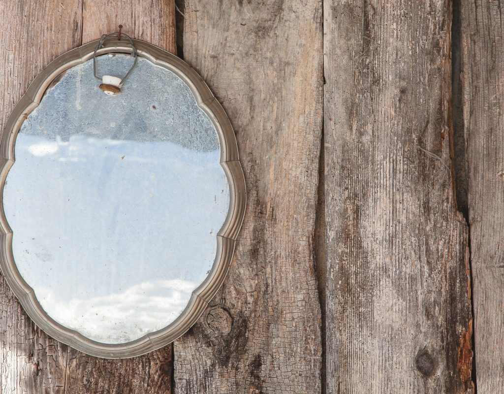 distressed and antique mirror on wood
