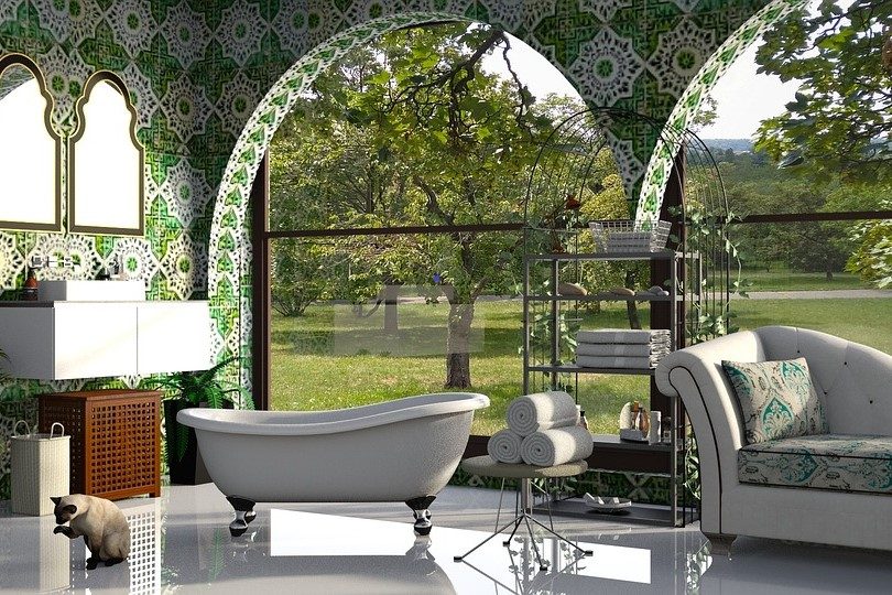 bathroom with green wallpaper, tub, and sofa