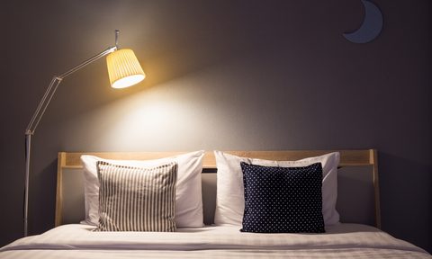 bedside arc lamp in bedroom