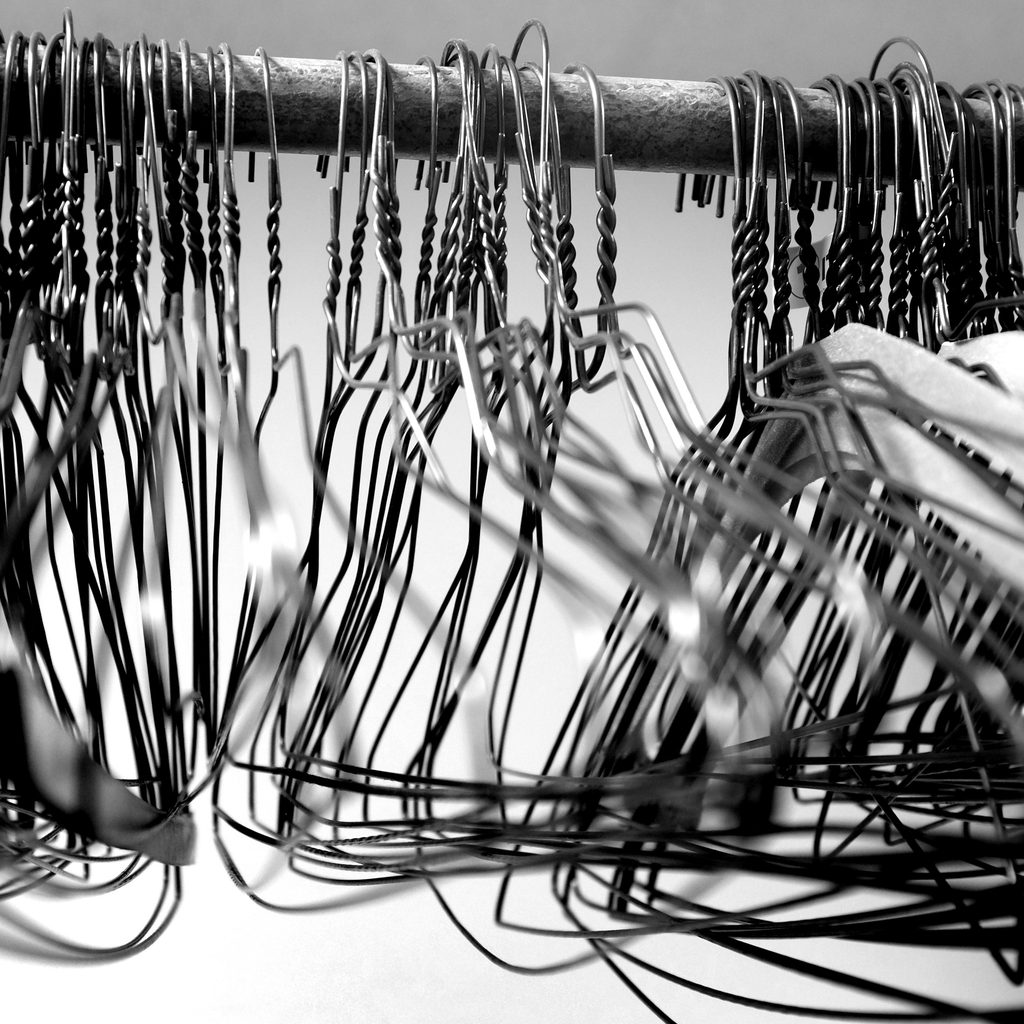wire hangers on a closet rod