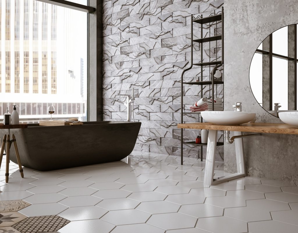 Black and white bathroom with black tub and large window with lots of light
