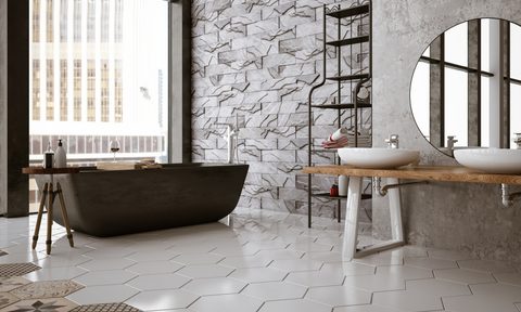 Black and white bathroom with black tub and large window with lots of light